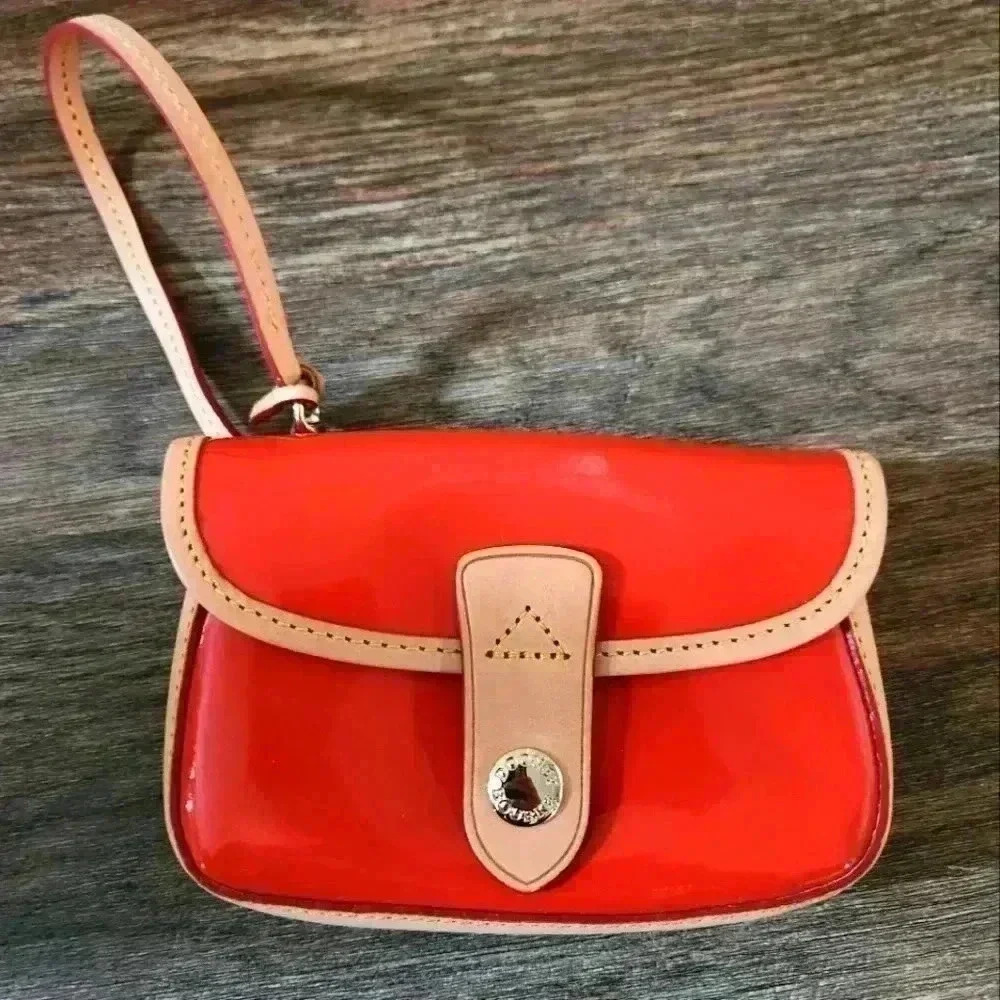 Dooney & Bourke Orange Patent Leather Wristlet with Cream Trim